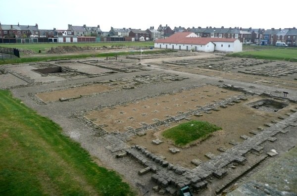 Excavations and reconstructed barracks